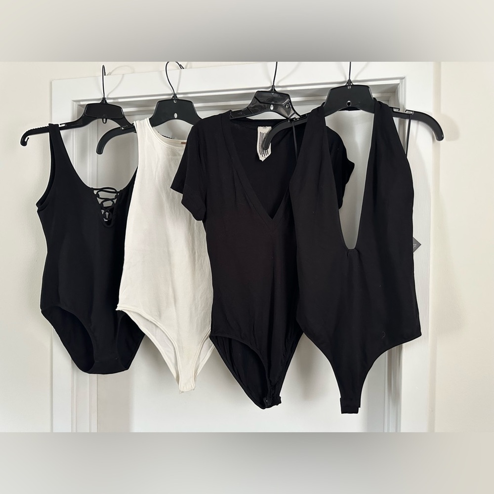 Bundle of 4 size medium Bodysuits